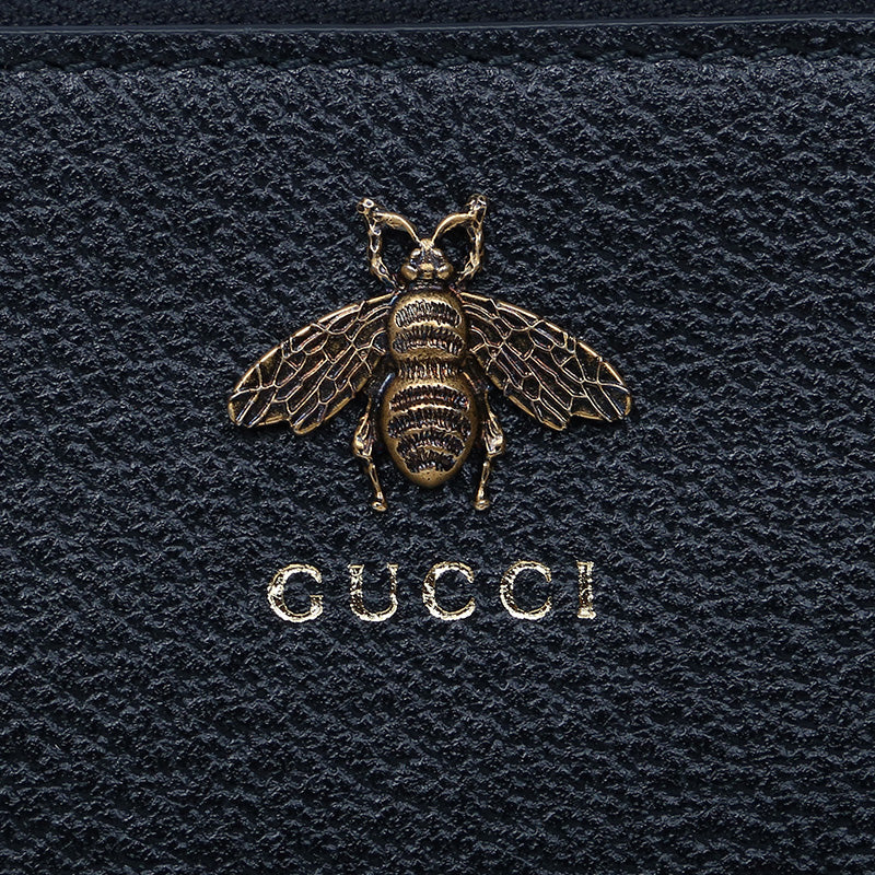 Gucci bee print hot sale gg supreme pouch